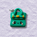 Cute luxury handbag-inspired charm